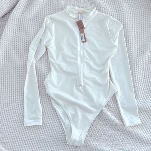 Skims “Swim Zip Front Long Sleeve One Piece” NWT size Medium, White color